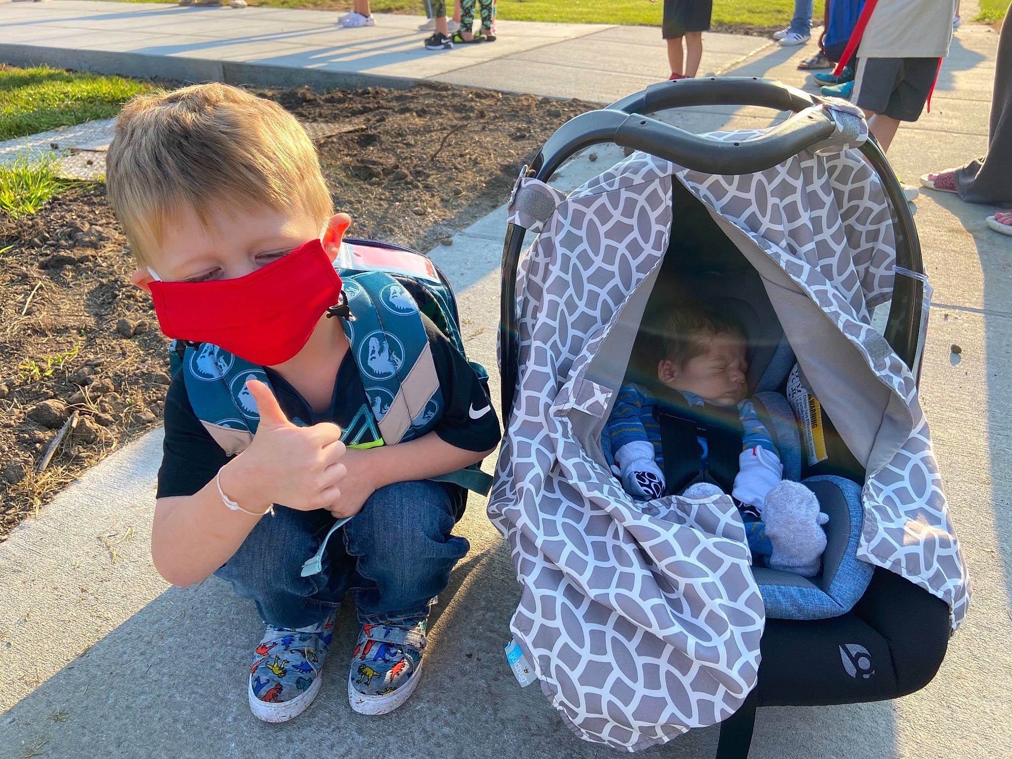 Kyson joined the competition — help win amazing prizes! asphalt, black, blue, city, fun, grass, green, leisure, luggage_and_bags, people, person, photograph, plant, public_space, recreation, shoe, sidewalk, snapshot, sneakers, toddler