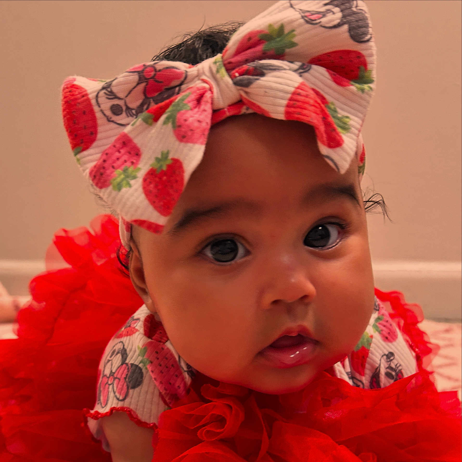 Mía Analia is registered to the contest to win money with this photo: adorable, baby, bow, child, closeup, clothing, cute, dress, eyes, face, frills, headband, indoor, infant, mouth, portrait, red, skin, strawberry, toddler
