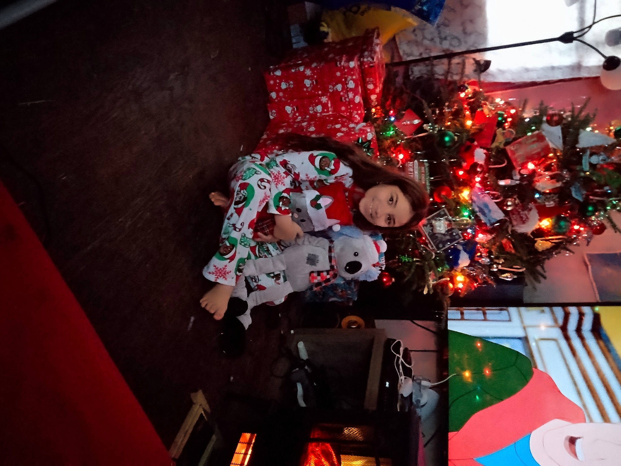 Isabella joined the competition — help win amazing prizes! carmine, christmas, christmas_decoration, christmas_eve, christmas_lights, christmas_ornament, christmas_tree, conifer, event, flooring, fun, holiday, holiday_ornament, interior_design, joy, ornament, person, plant, room, tradition