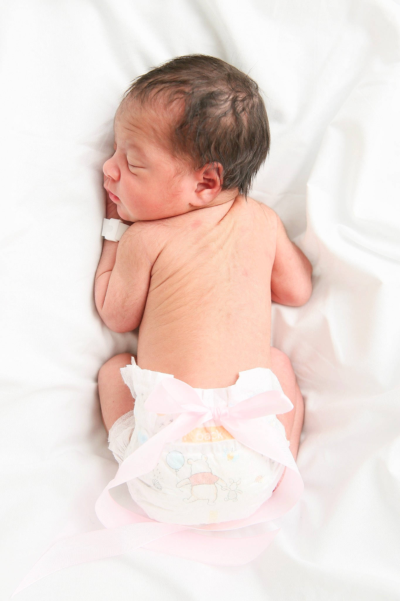 Layliana joined the competition — help win amazing prizes! abdomen, arm, baby, baby_products, baby_safety, baby_sleeping, baby_toddler_clothing, bedding, chest, child, comfort, diaper, event, happy, linens, peach, person, room, sitting, stomach