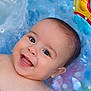 Sohan a rejoint le concours — aidez-le/la à gagner de superbes lots ! baby, infant, smiling, face, water, pool, floating, happy, child, skin, head, mouth, eyes, ear, cheeks, play, summer, colorful, toy, inflatable