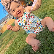 Kensley joined the competition — help win amazing prizes! baby, child, grass, outdoor, sunny, headband, pink_bow, pacifier, smiling, floral_outfit, barefoot, yard, bench, fence, plant, happy, summer, cute, infant, playful
