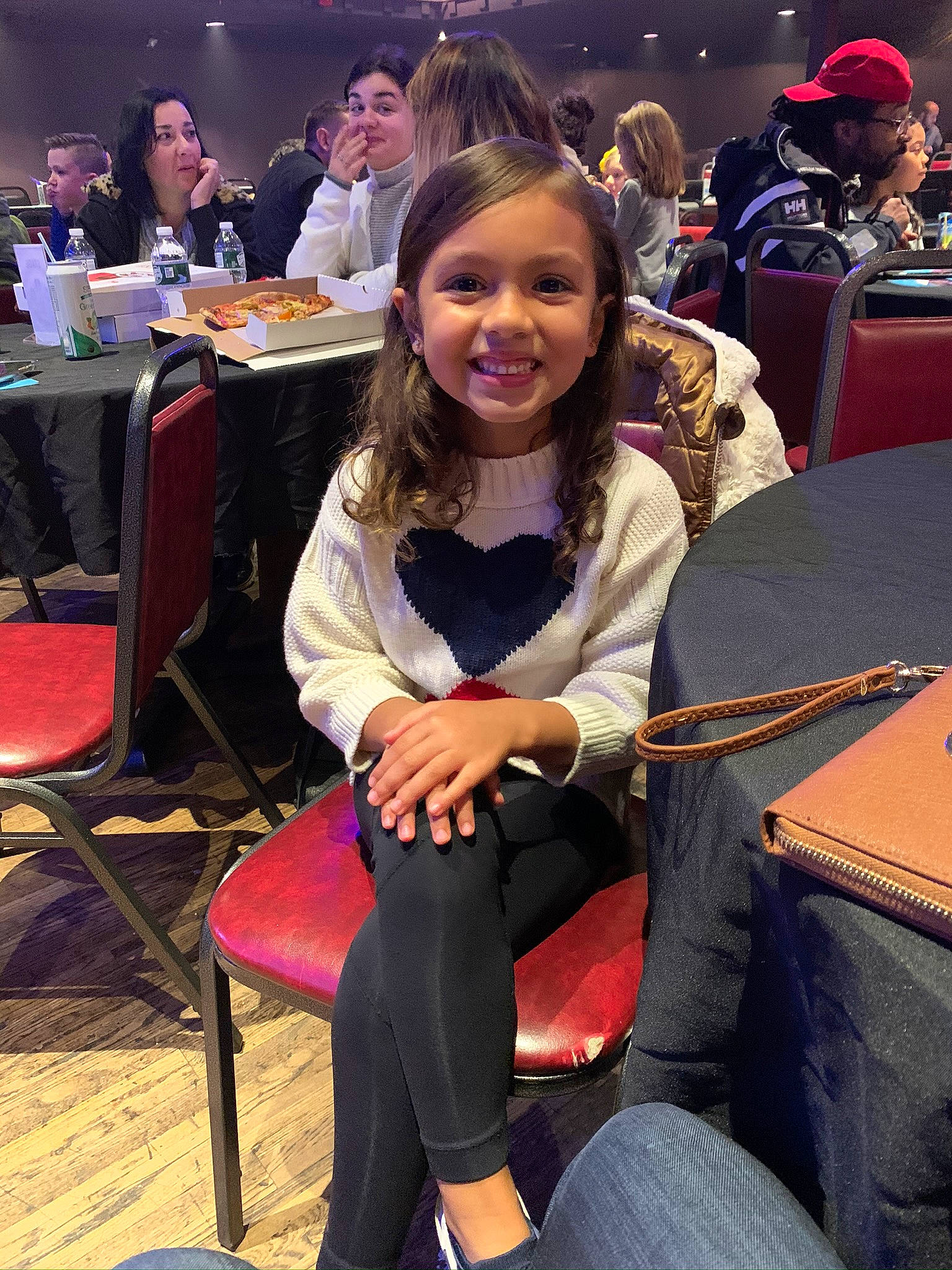 Kira joined the competition — help win amazing prizes! black, brown_hair, chair, clothing, community, event, face, fashion_design, fun, furniture, happy, head, human_leg, jewellery, joy, lap, leisure, long_hair, person, smile