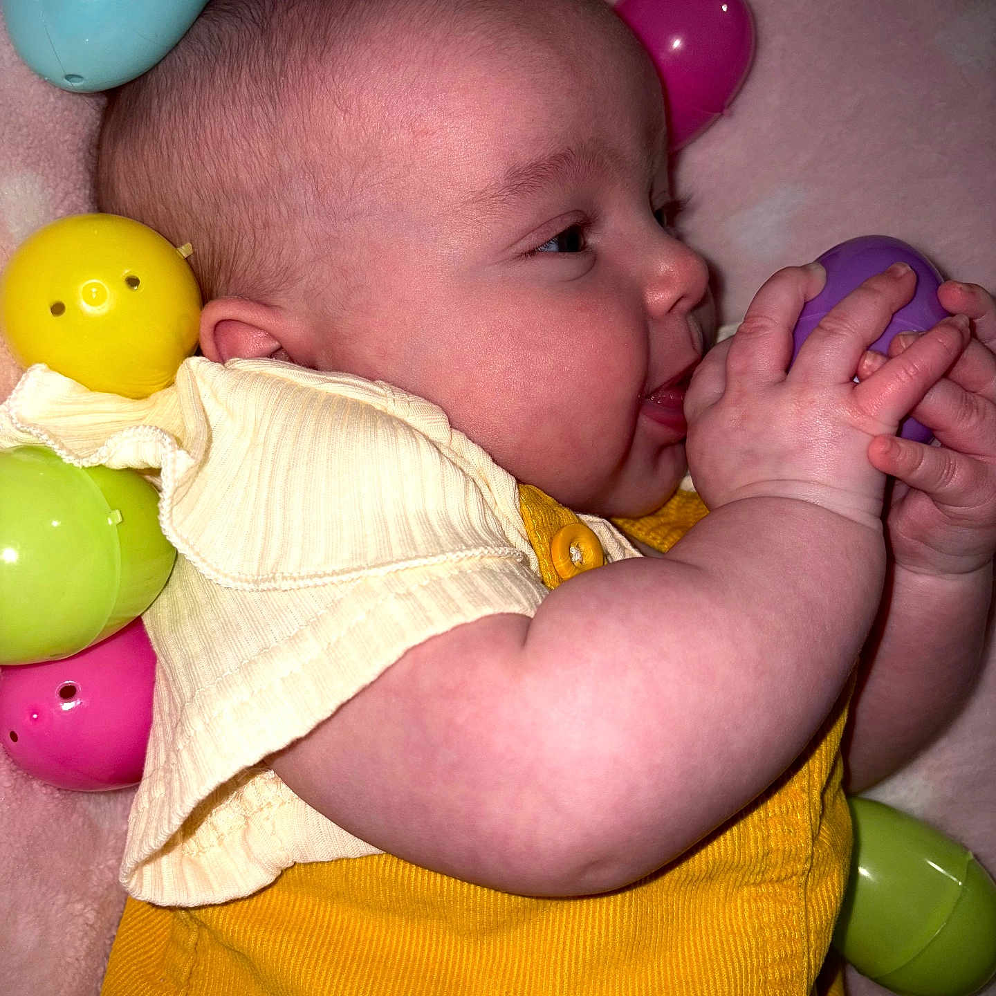 Lydia is registered to the contest to win money with this photo: accessories, baby, balloon, bed, bodypart, couch, face, finger, furniture, hand, happy, head, jewelry, newborn, person, photography, portrait, purple, quilt, sleeping