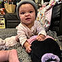 Azrahbella joined the competition — help win amazing prizes! baby, child, infant, beanie, pink_clothing, plush_toy, carpet, crawling, indoor, foot, hand, face, expression, blanket, sofa, bag, toy, living_room, cute, messy