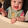 baby, bib, blanket, blue_eyes, child, clothing, couch, feeding, food, furniture, happy, high_chair, indoor, messy_face, person, portrait, short_hair, smiling, table, toddler