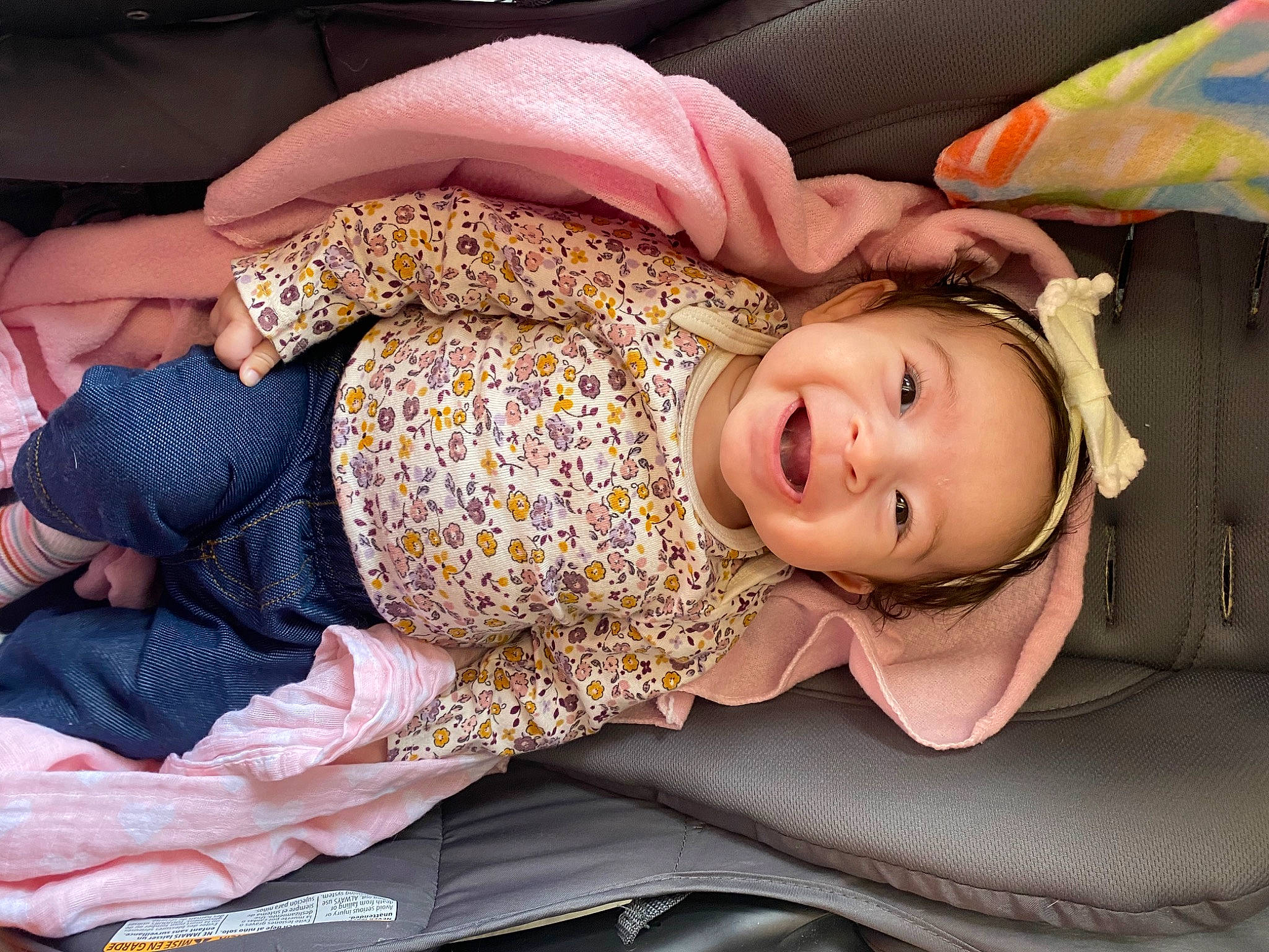 Kezrah is registered to the contest to win money with this photo: abdomen, blond, cheek, child, comfort, eyelash, fashion_accessory, fun, happy, hat, human_body, human_leg, lap, pattern, person, sitting, smile, textile, thigh, toddler