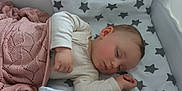 Artemis is registered to the contest to win money with this photo: baby, bed, blanket, child, cozy, crib, cute, face, hand, indoors, infant, pajamas, pattern, peaceful, rest, sleeping, soft, star, toddler, young