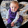 baby, child, purple_vest, bowtie, sitting, blanket, indoor, cute, portrait, infant, face, eyes, smile, clothing, footwear, hands, cozy, soft_texture, heart_frame, curious