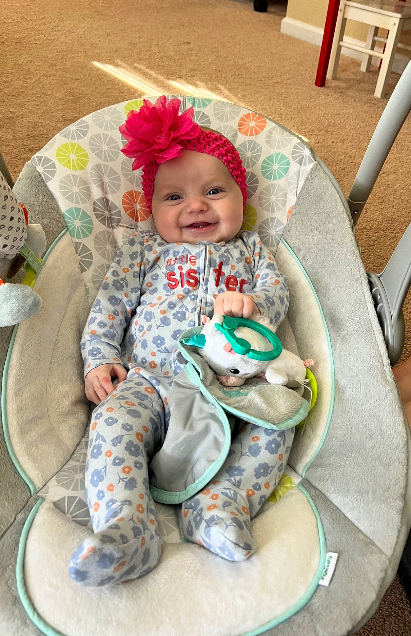 Jane is registered to the contest to win money with this photo: baby, baby_carriage, baby_products, baby_toddler_clothing, chair, child, comfort, fashion_accessory, grass, happy, headwear, joy, lap, pattern, person, personal_protective_equipment, play, sandal, sitting, sleeve