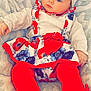 baby, child, infant, toddler, face, headband, bow, red_tights, floral_dress, blanket, plush, soft, cute, clothing, portrait, indoor, person, blue_eyes, hands, legs