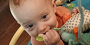 Mason joined the competition — help win amazing prizes! baby, child, toy, plaything, indoor, face, hand, seat, colorful, curious, infant, couch, floor, plastic, chewing, smiling, cute, person, young, home