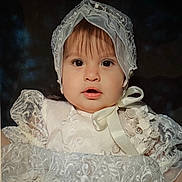 Mia joined the competition — help win amazing prizes! baby, child, face, portrait, white_dress, lace, bonnet, ribbon, flower, closeup, cute, young, infant, expression, soft_lighting, indoors, person, headwear, elegant, costume