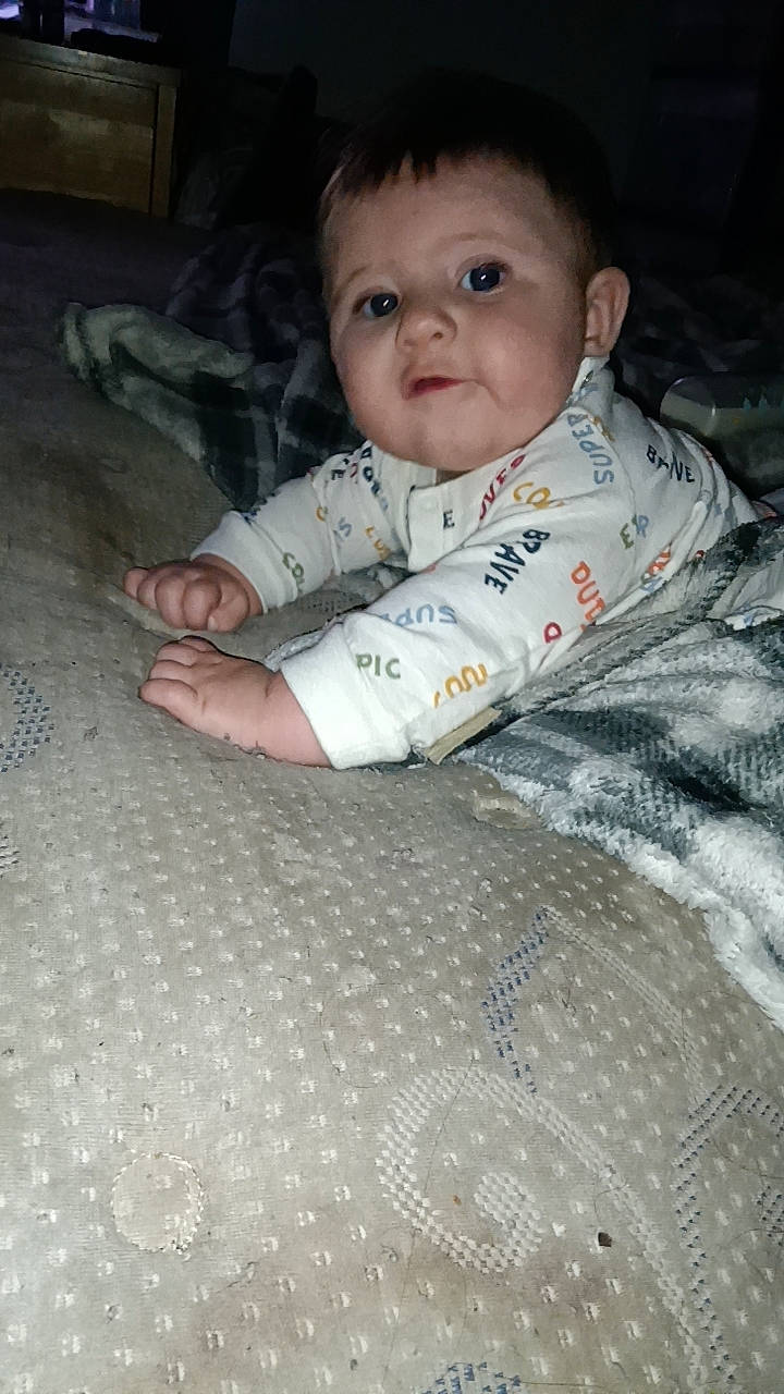 Karson joined the competition — help win amazing prizes! baby, baby_products, baby_toddler_clothing, carmine, cheek, child, comfort, eye, face, flooring, fun, head, linens, nose, person, room, sitting, skin, sleeve, toddler