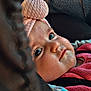 Romy a rejoint le concours — aidez-le/la à gagner de superbes lots ! baby, infant, child, face, big_eyes, long_eyelashes, knit_hat, pink_clothing, cheeks, drool, close_up, portrait, car_seat, seatbelt, stroller, soft_texture, fabric, warm_lighting, candid, innocence