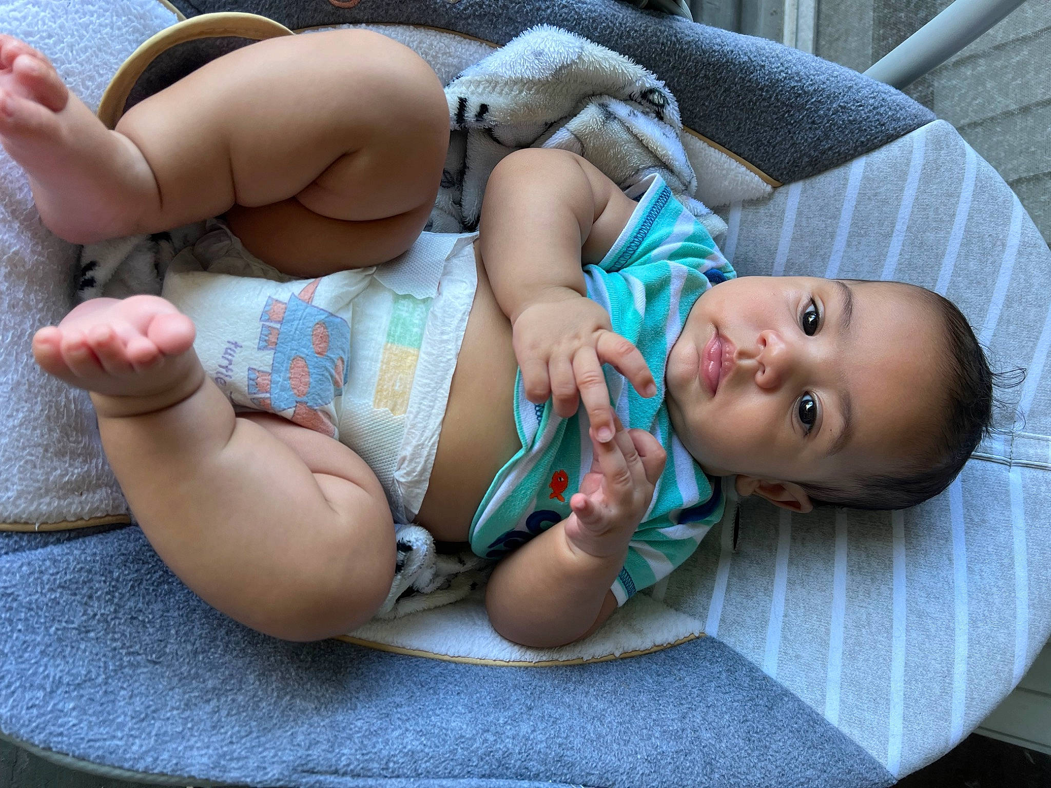 Dari is registered to the contest to win money with this photo: abdomen, baby, baby_products, baby_sleeping, baby_toddler_clothing, cheek, chest, child, comfort, finger, grass, hand, human_body, human_leg, pattern, person, sitting, skin, thigh, toddler