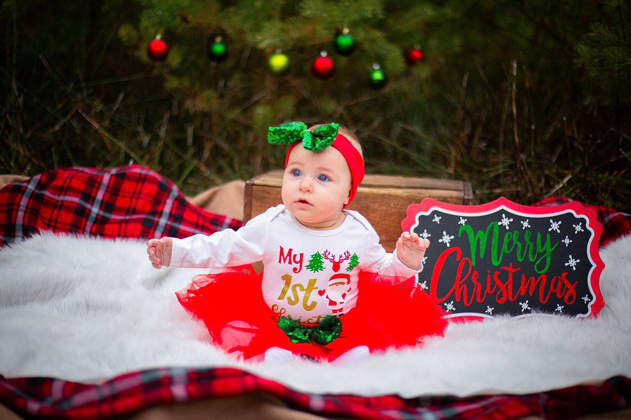 Millie is registered to the contest to win money with this photo: baby, baby_toddler_clothing, child, christmas, christmas_decoration, christmas_eve, christmas_ornament, christmas_tree, costume, costume_accessory, event, fictional_character, fir, holiday, holiday_ornament, interior_design, person, red, toddler, tree