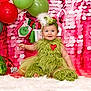 baby, balloon, clothing, costume, dress, elf, face, festival, fun, hair, hat, head, newborn, party, people, person, photography, portrait, sitting, toy
