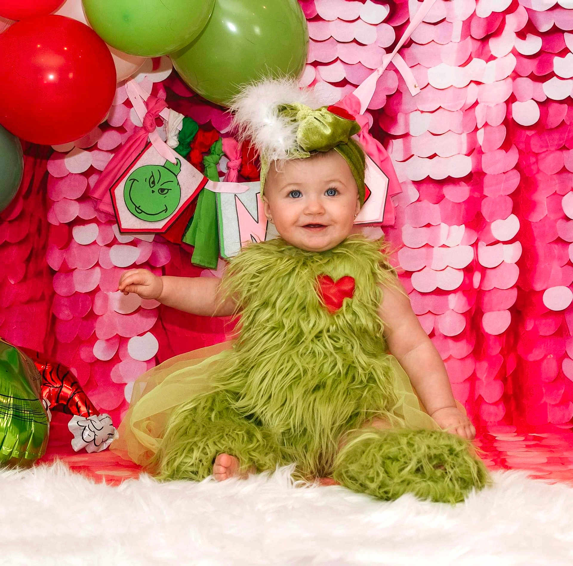 Brynlee joined the competition — help win amazing prizes! baby, balloon, clothing, costume, dress, elf, face, festival, fun, hair, hat, head, newborn, party, people, person, photography, portrait, sitting, toy