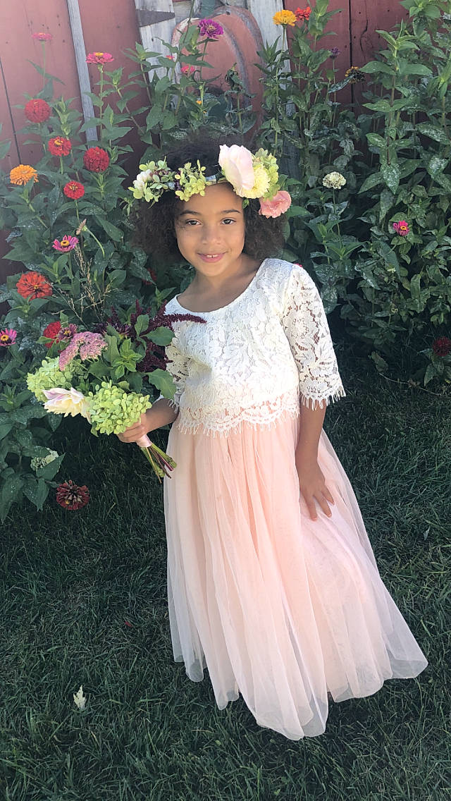 Jerrica is registered to the contest to win money with this photo: botany, bridal_party_dress, child, child_model, clothing, costume, dress, fashion_accessory, floristry, flower, formal_wear, gown, hair_accessory, headpiece, headwear, joy, lace, peach, person, petal