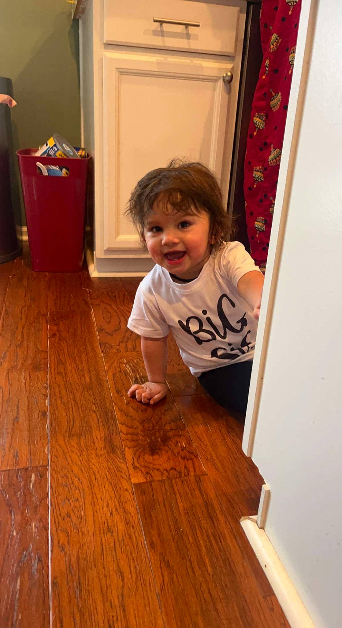 Mia joined the competition — help win amazing prizes! baby_toddler_clothing, child, door, floor, flooring, fun, hardwood, home_door, house, laminate_flooring, person, plank, room, smile, standing, t_shirt, toddler, varnish, wood, wood_flooring