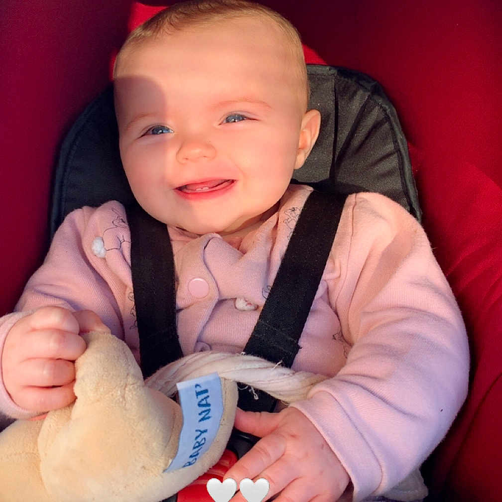 Noellya participe au concours pour gagner de l'argent avec cette photo : baby, blanket, blue_eyes, car_seat, cute, fingers, hand, happy, harness, infant, pink_clothing, plush_toy, portrait, red_upholstery, rosy_cheeks, seat_belt, shadow, smile, stroller, sunlight