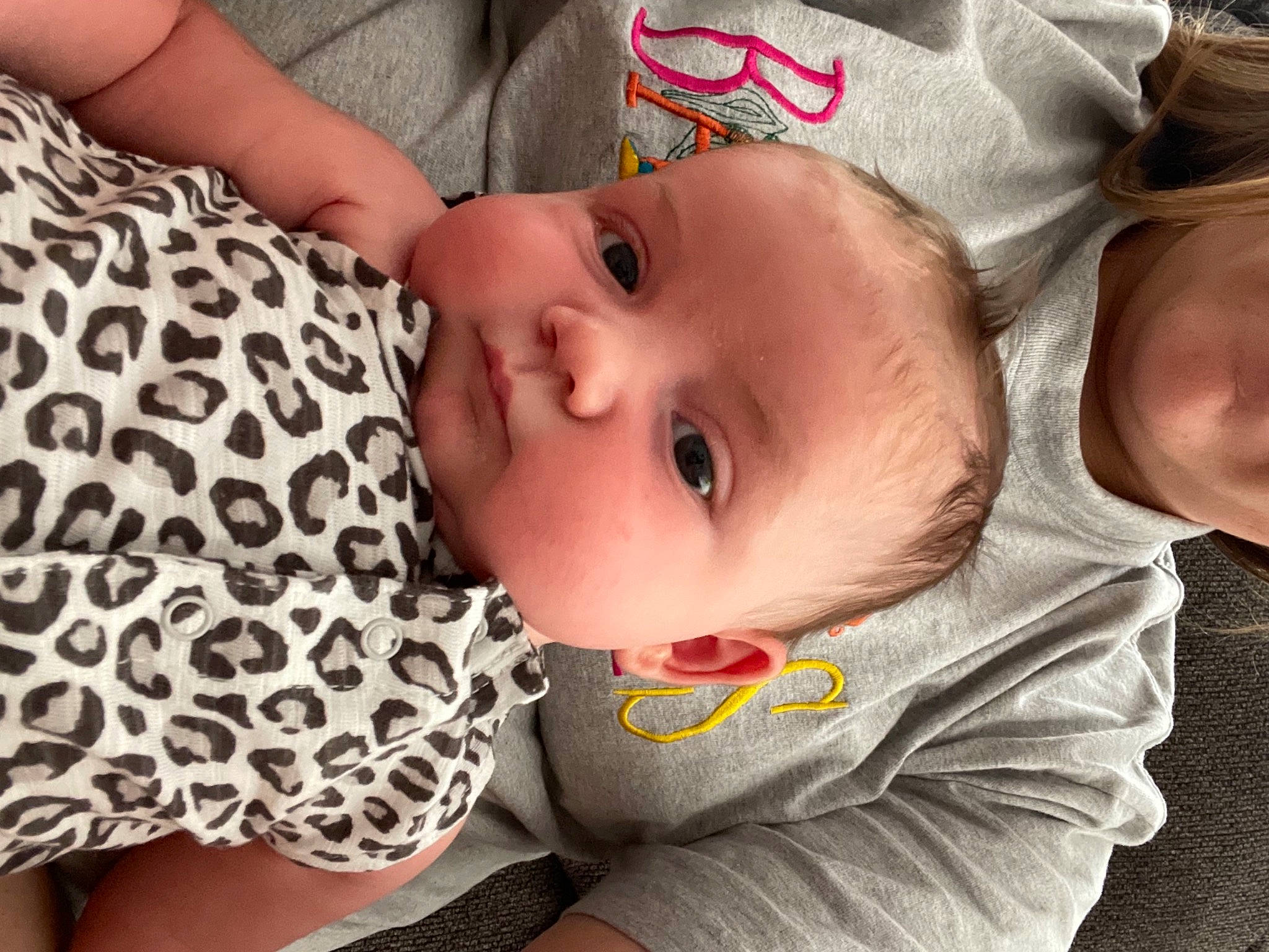 Georgia joined the competition — help win amazing prizes! arm, baby, baby_products, baby_toddler_clothing, cheek, child, comfort, eyelash, facial_expression, grass, human_body, iris, lip, mammal, mouth, nose, pattern, person, skin, toddler