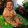 Oliver is registered to the contest to win money with this photo: baby, smiling, easter_eggs, green_grass, flowers, colorful, indoors, cute, child, playful, spring, happy, portrait, sitting, barefoot, clothing, decor, bright, holiday, celebration