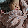 baby, newborn, sleeping, blanket, pink, heart_pattern, cozy, soft, infant, peaceful, bed, bedding, wrapped, resting, cute, face, skin, hand, quiet, indoors