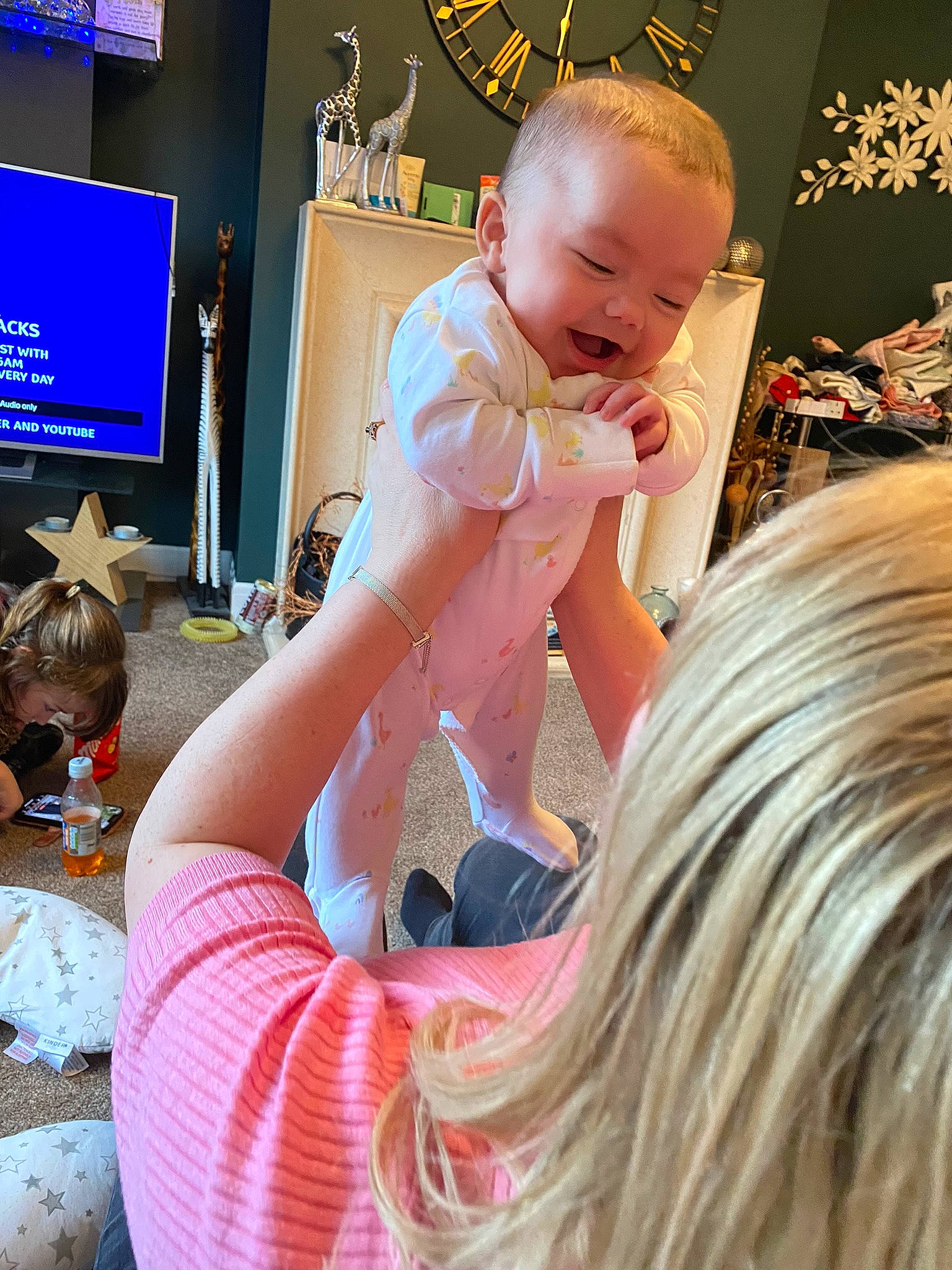 Lillie is registered to the contest to win money with this photo: arm, baby, child, cool, ear, eye, finger, fun, hairstyle, hand, happy, human, leisure, mouth, organ, person, pink, skin, smile, television