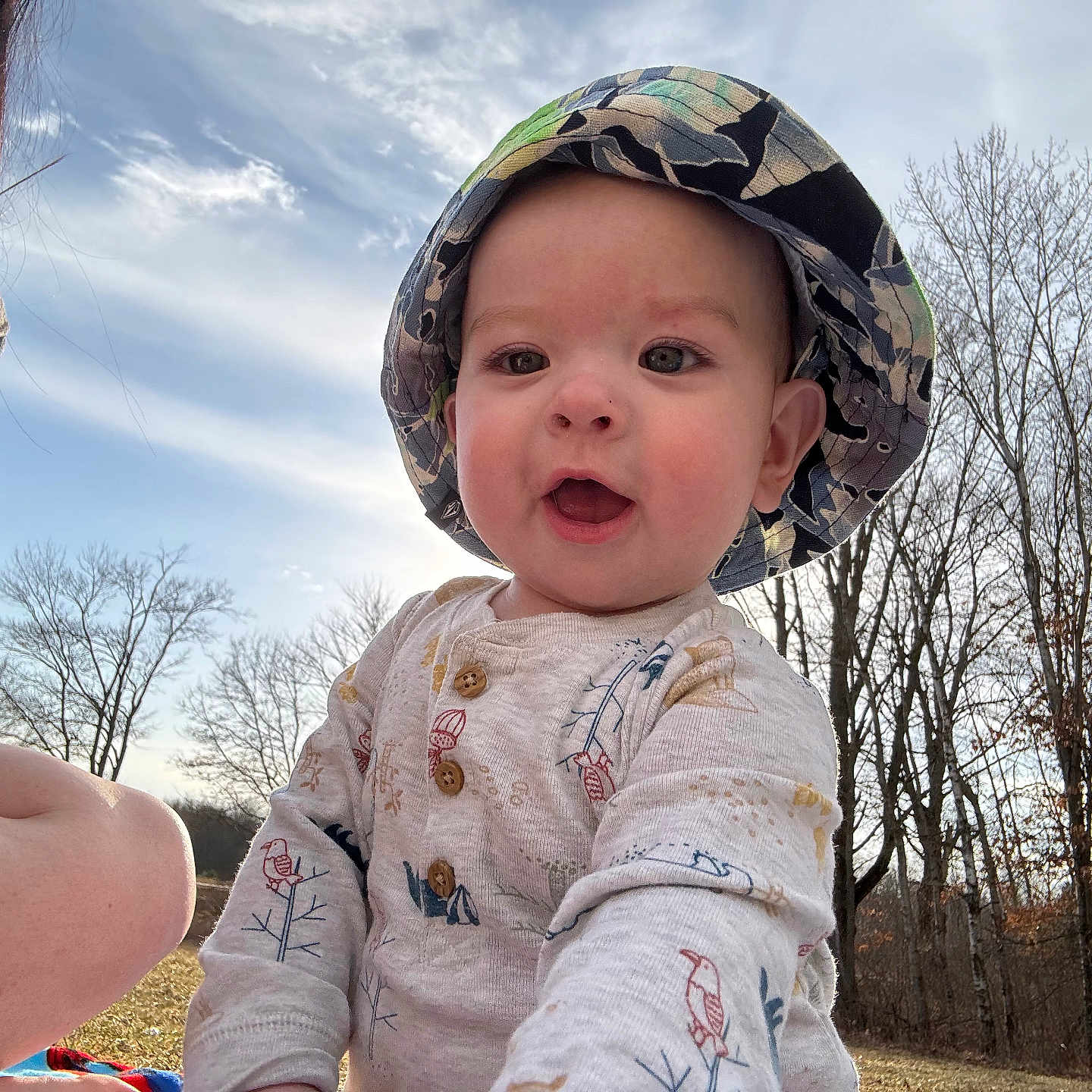 Cade joined the competition — help win amazing prizes! baby, cap, clothing, coat, face, grass, hardhat, hat, head, helmet, jacket, land, nature, outdoors, person, photography, plant, portrait, tree, vegetation