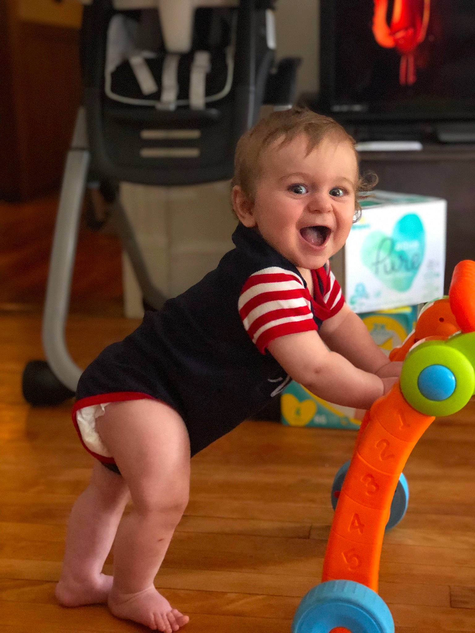 Jackson is registered to the contest to win money with this photo: arm, baby, baby_playing_with_toys, baby_products, baby_toys, child, fun, joint, leg, person, play, product, sitting, smile, standing, thigh, toddler, toy