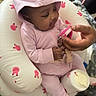 Divinity joined the competition — help win amazing prizes! baby, child, infant, pink_hoodie, pacifier, inflatable_seat, bunny_print, socks, hand, interaction, indoor, blanket, phone, cute, smiling, seated, cozy, comfort, person, toddler