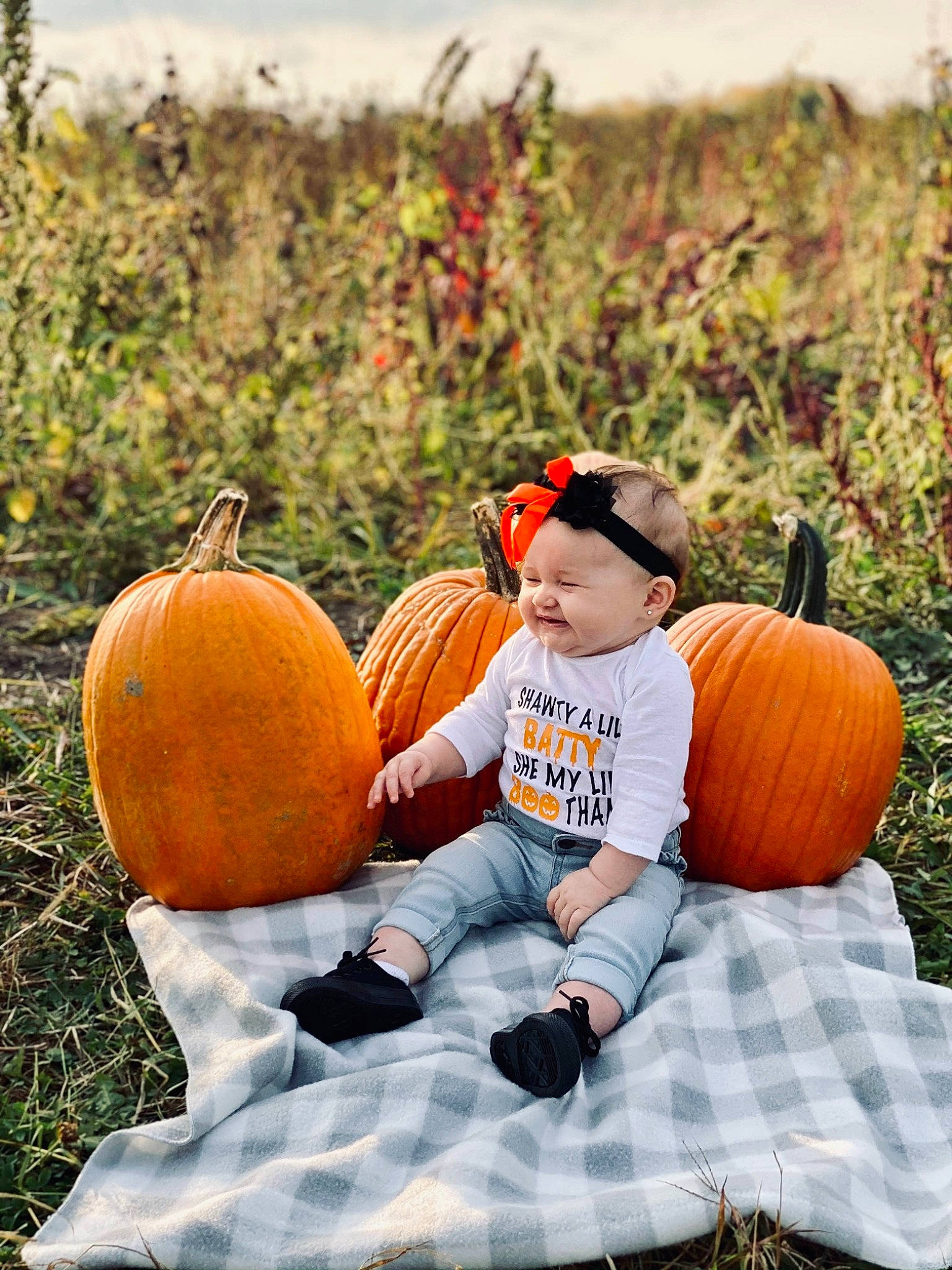 Khloe is registered to the contest to win money with this photo: calabaza, cucurbita, gourd, grass, happy, head, headwear, human_body, local_food, morning, natural_foods, orange, people_in_nature, person, plant, pumpkin, sky, smile, squash, vegetable