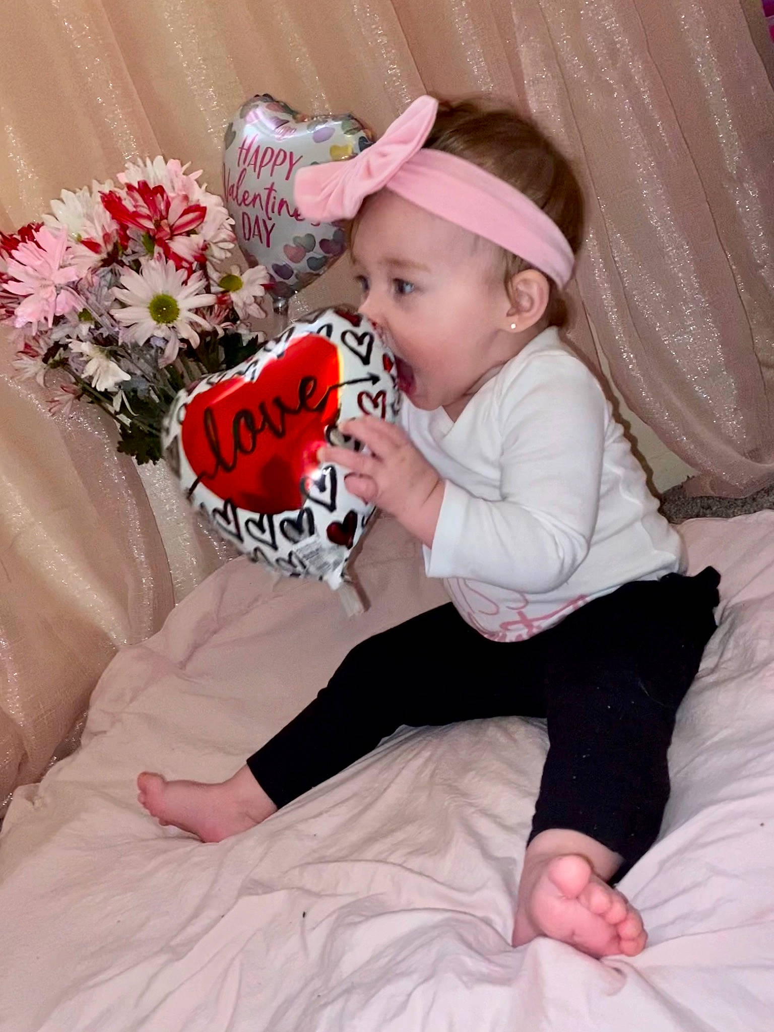 Khloe is registered to the contest to win money with this photo: baby, baby_toddler_clothing, child, comfort, dress, facial_expression, finger, fun, happy, hat, human_body, magenta, person, petal, pink, plant, skin, sleeve, snapshot, textile