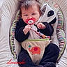 baby, baby_rocker, child, clothing, comfort, cozy, cushion, cute, face, feet, hair, hands, indoor, light, onesie, pacifier, paw_prints, smiling, soft_toy, window