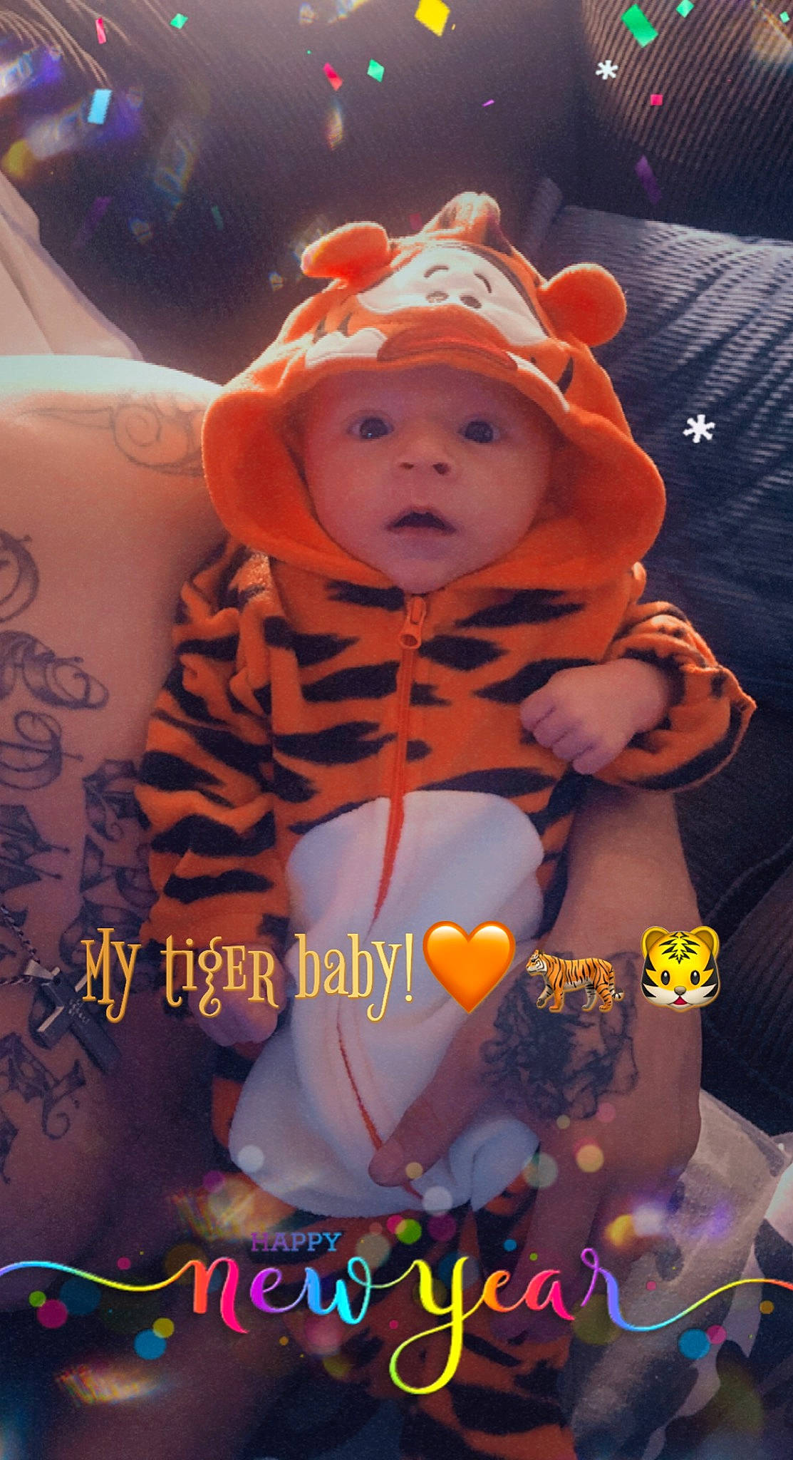 Jose is registered to the contest to win money with this photo: baby, baby_products, baby_toddler_clothing, child, fictional_character, happy, headwear, icing, orange, pattern, person, personal_protective_equipment, photo_caption, stuffed_toy, teddy_bear, toddler