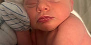 Isaiah Jr. is registered to the contest to win money with this photo: baby, blanket, closeup, comfort, cozy, cute, handwear, infant, mittens, nap, newborn, peaceful, person, portrait, resting, skin, sleeping, soft, warm, young_child