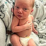 baby, blanket, child, cozy, cute, cute_expression, diaper, facial_expression, hand, indoors, infant, lying_down, newborn, person, resting, skin, small, soft_texture, wrapped, young