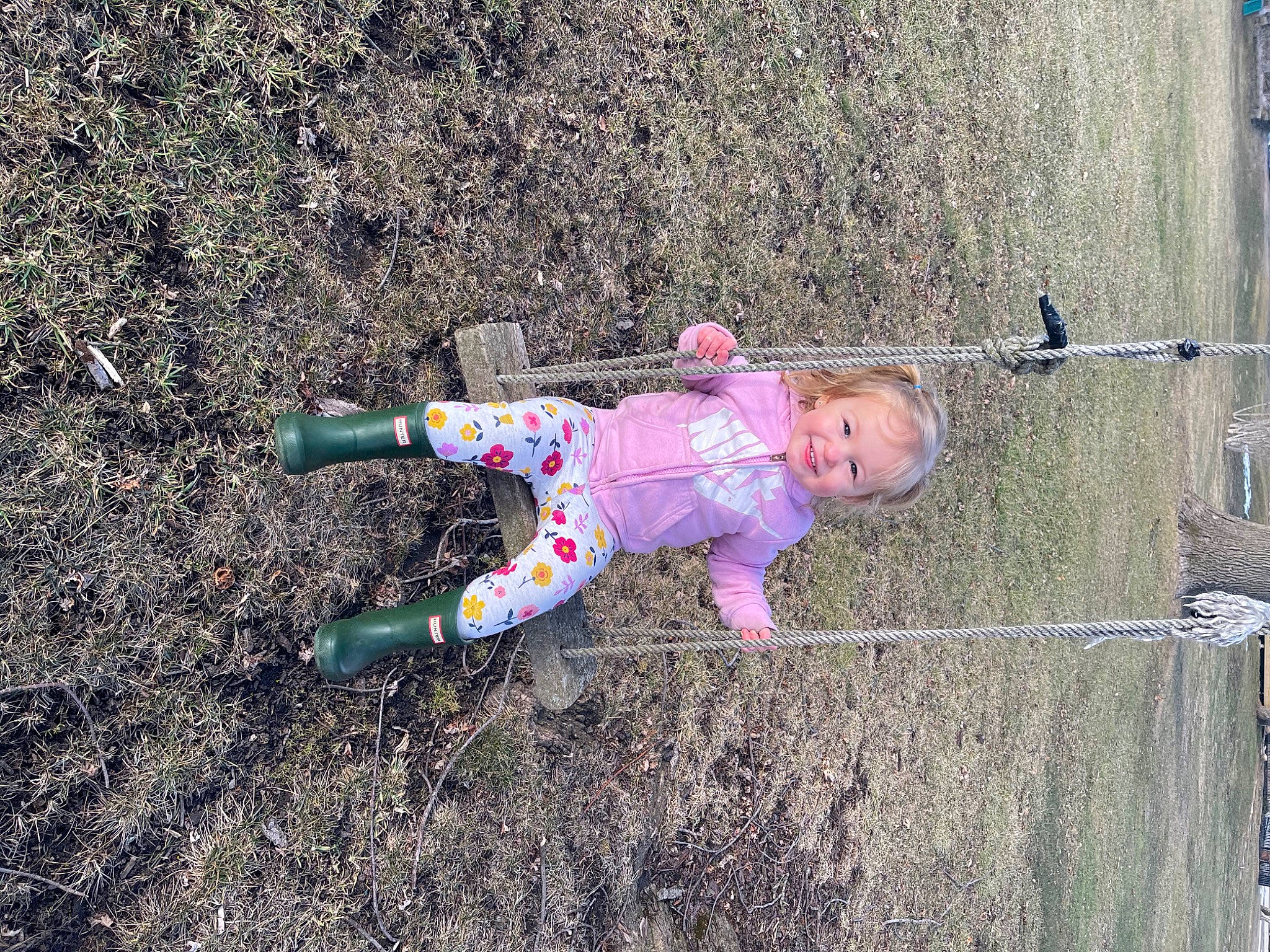 Evelyn is registered to the contest to win money with this photo: asphalt, baby, baby_toddler_clothing, child, city, concrete, fun, grass, joy, landscape, leisure, magenta, people_in_nature, person, play, recreation, road_surface, shadow, sidewalk, soil