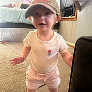 Bria joined the competition — help win amazing prizes! baby, bed, camo, cap, carpet, casual, child, curious, curtain, furniture, home, indoor, person, shirt, shorts, smile, standing, toddler, window, young_child