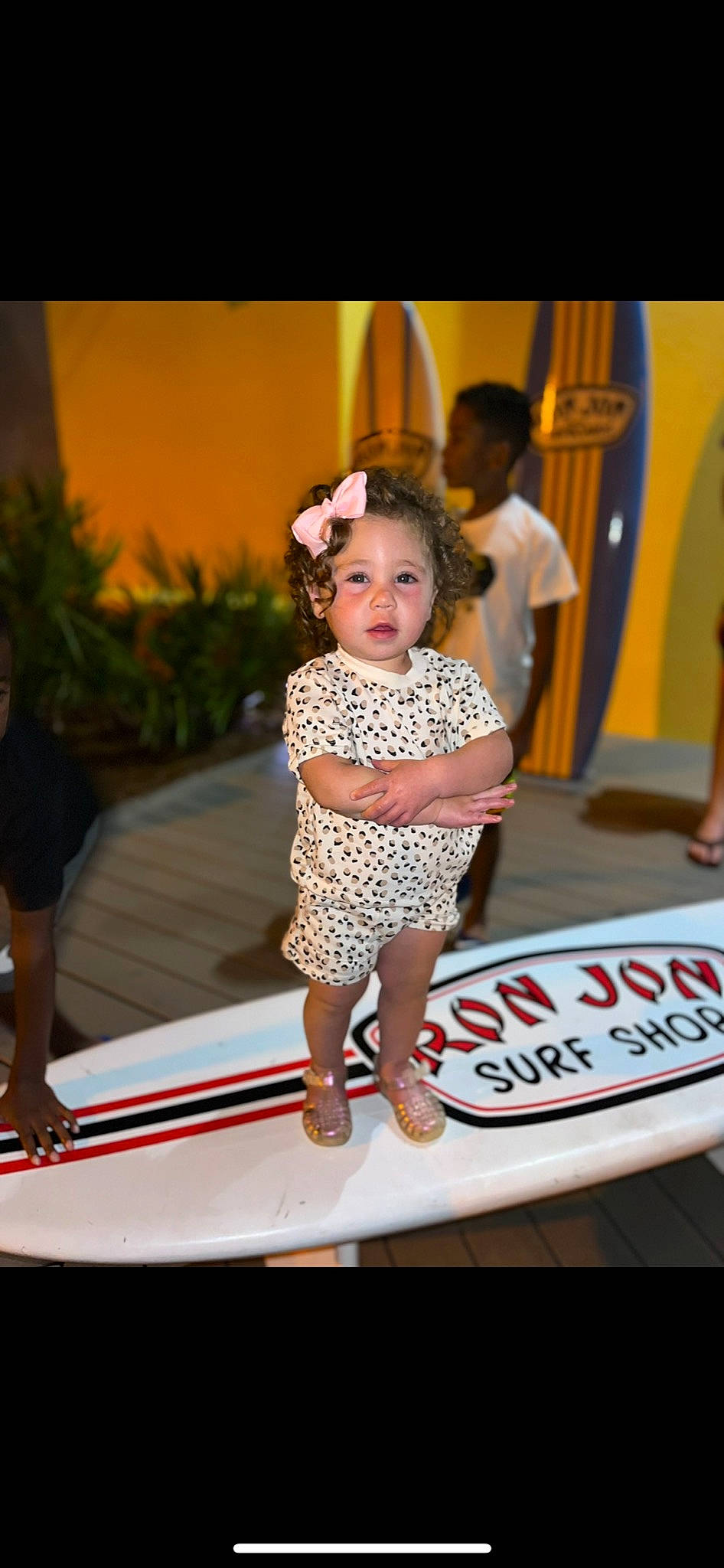 Gia is registered to the contest to win money with this photo: child, entertainment, event, fashion_design, flooring, fun, happy, leisure, party, performance, performance_art, performing_arts, person, plant, recreation, sandal, shorts, t_shirt, toddler, under_exposed