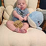 Frederick joined the competition — help win amazing prizes! baby, infant, child, plush_toy, whale, wooden_sign, three_months, rocking_chair, cushion, blue, tongue_out, clothing, cute, sitting, indoor, wood, soft_texture, face, person, smiling