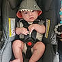 baby, infant, car_seat, shark_hoodie, clothing, child, cute, sitting, seatbelt, indoors, person, headwear, looking, chubby_legs, hood, expression, safety, straps, foot, hand