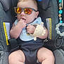 Frederick joined the competition — help win amazing prizes! baby, child, car_seat, sunglasses, toy, teether, plush_toy, reflection, hand, foot, clothing, seatbelt, infant, cute, casual, relaxing, indoor, accessory, colorful, comfort