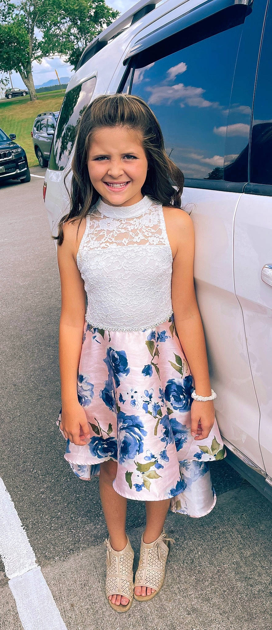 Karlee is registered to the contest to win money with this photo: automotive_design, automotive_exterior, automotive_tire, blue, cool, day_dress, dress, electric_blue, eyewear, fashion, happy, joy, motor_vehicle, person, shoulder, skin, sleeve, smile, summer, thigh