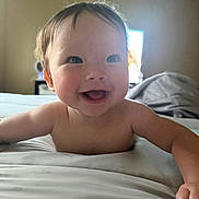 Elliana joined the competition — help win amazing prizes! baby, smiling, happy, face, child, bed, blanket, indoors, skin, person, cute, portrait, young, infant, expression, human, head, hair, cheerful, toddler