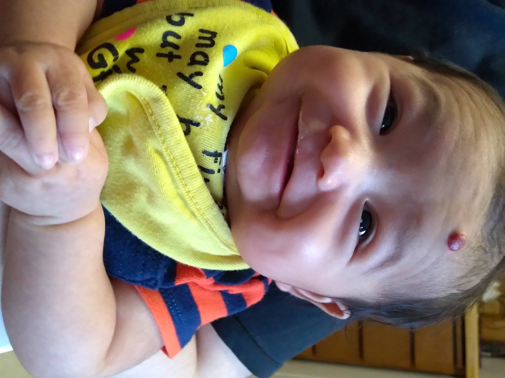 Frank is registered to the contest to win money with this photo: baby, baby_toddler_clothing, cheek, ear, eyebrow, eyelash, facial_expression, finger, gesture, hand, happy, iris, lip, mouth, neck, nose, person, skin, smile, toddler