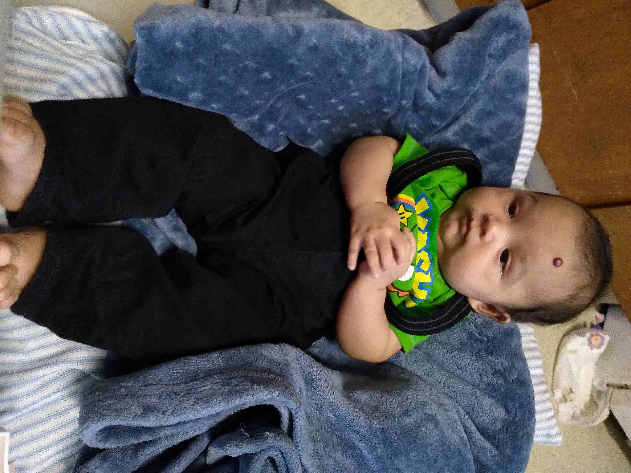 Frank joined the competition — help win amazing prizes! baby, baby_products, baby_toddler_clothing, cheek, child, comfort, facial_expression, finger, fun, grass, hand, human_body, knee, lap, leg, mammal, person, sitting, toddler, vertebrate