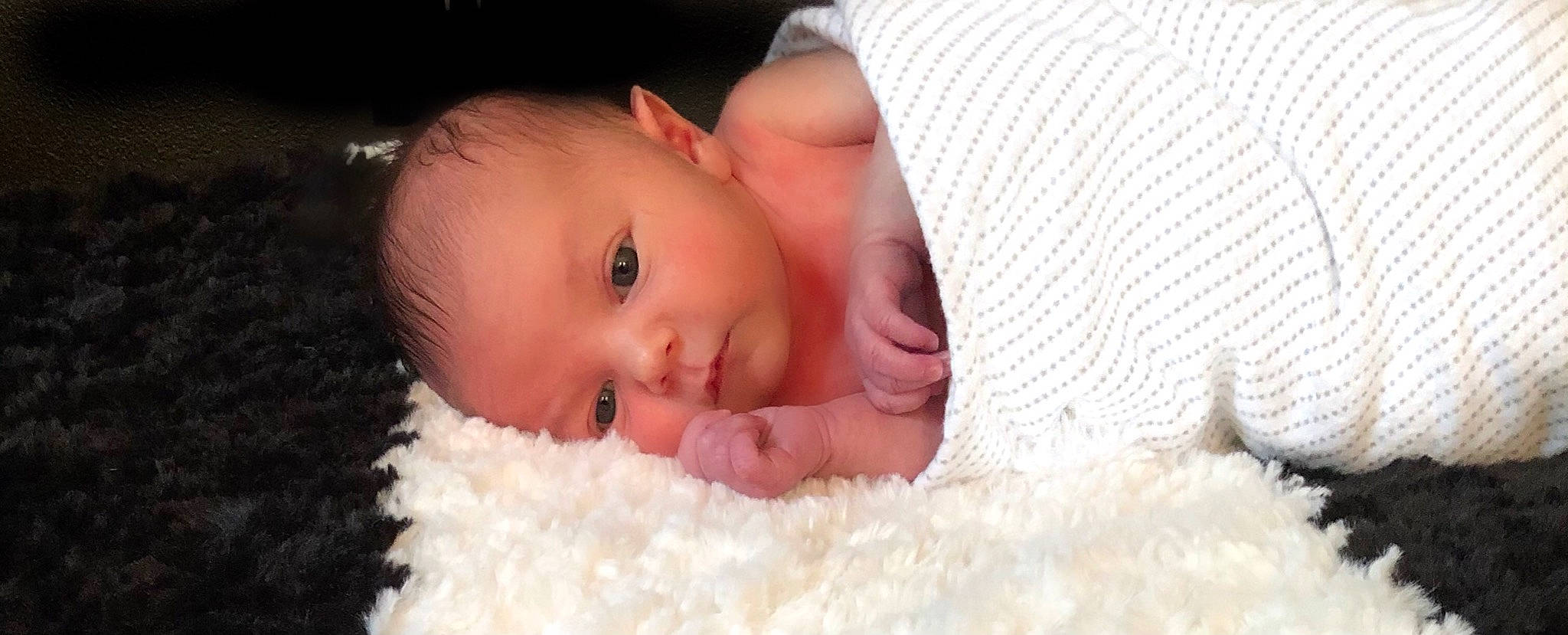 Banks is registered to the contest to win money with this photo: baby, baby_toddler_clothing, cheek, child, chin, comfort, eye, eyebrow, eyelash, flash_photography, happy, headgear, iris, linens, lip, mouth, neck, nose, person, skin